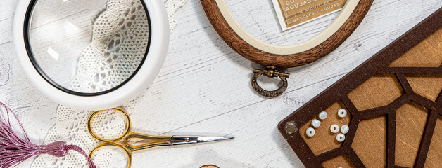 Accessories for hobby. Hoop snaps, scissors, threads, needles and scissors. Vintage tools for embroidery and knitting