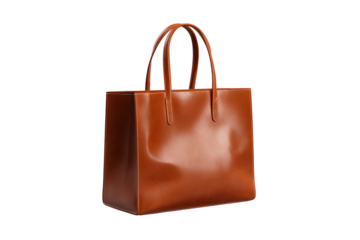 Stylish brown leather tote bag isolated on black background.