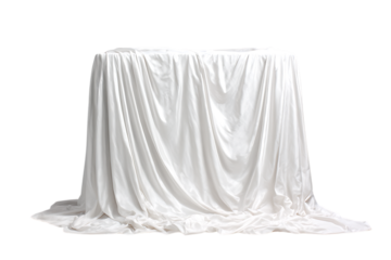White cloth draped over an unseen object, creating intrigue and suspense.
