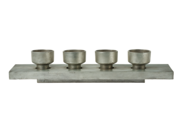Four metallic cylinders arranged on a rectangular plate. Industrial, mechanical, or engineering concept.