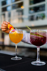 Bartender mixing and serving cocktails