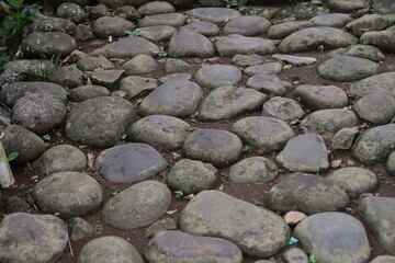 Close Up Stone Pathway. Traditional stone pathway in a rural Indonesian village. The path is made...