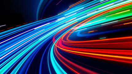 Colorful light trails create an abstract motion background, a vibrant pattern of energy on a night highway
