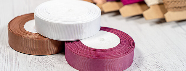 Colored ribbons and lace in coils for hobbies