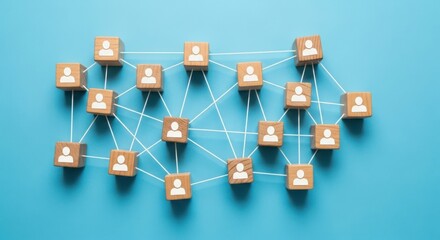 Connected wooden cubes with people icons forming a network on a blue background