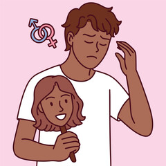 Dark-skinned transgender man holds mask of smiling black woman while feeling confused and distressed, struggling with gender dysphoria and identity acceptance
