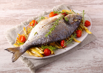 stream bream, dorada fish with beans and tomato