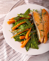 Salmon with baby carrot and pea