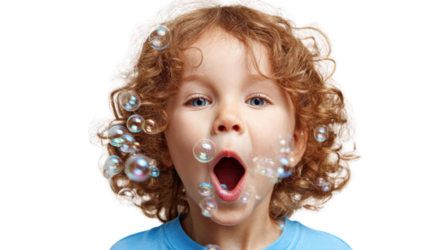 Excited child blowing bubbles, joyful expression, vibrant atmosphere, playful moment captured in time.