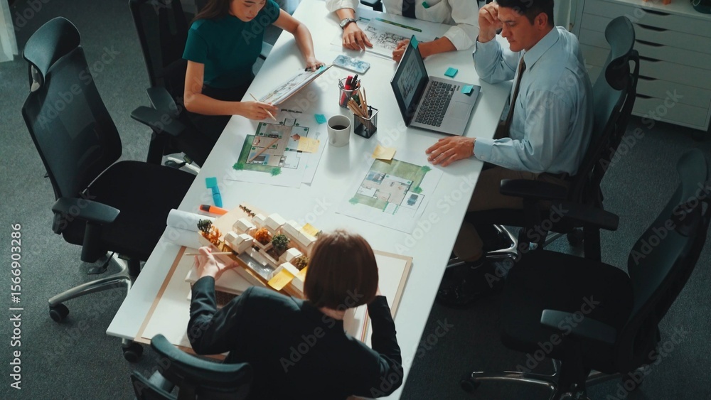 Aufkleber group of diverse team planning strategy while sitting at table with project plan. top aerial view of