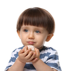 Cute little child eating tasty mochi on white background
