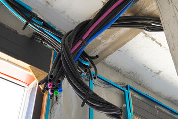 Electrical wiring in corrugated plastic pipes. Pipes are part of electrical installation works for...