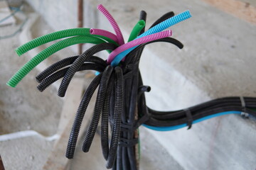 Electrical wiring in corrugated plastic pipes. Pipes are part of electrical installation works for the infrastructure of buildings, engineering systems and processes of the construction industry.