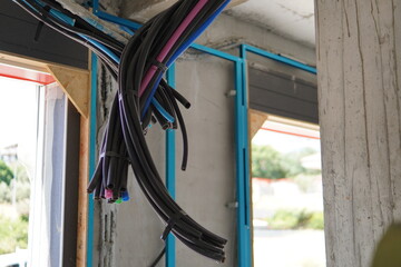 Electrical wiring in corrugated plastic pipes. Pipes are part of electrical installation works for...