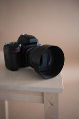 Camera with lens and flash drives. brown background