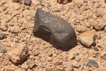 A black stone on the ground