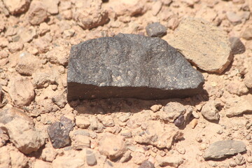 A black stone on the ground