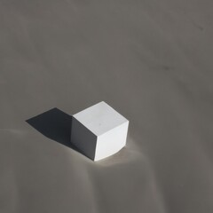 Minimalist White Cube on Grey Surface