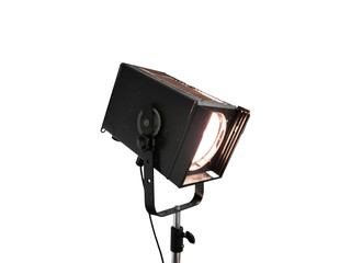 Close-up of vintage spotlight with lit lamp is isolated.