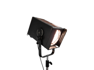 Close-up of vintage spotlight with lit lamp is isolated.