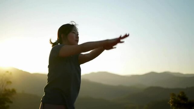 A woman doing light exercise and Yoga in sunrise light, soft breeze moving gently, scenic natural view in background, peaceful and healthy mood