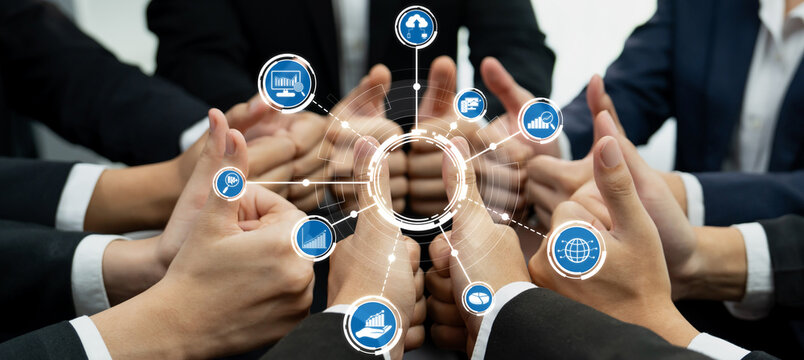 Hands coming together in a thumbs-up gesture during a business meeting, representing teamwork and collaboration, enhanced by digital icons symbolizing data and analysis. Amity