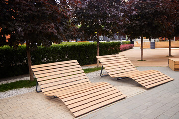 Benches for relaxing lying in the park. Modern landscape design