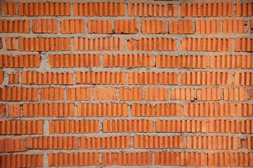 The texture of a brick wall with ribs.