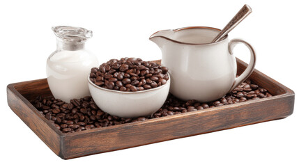 Coffee beans, milk jug and cream in a wooden tray on isolated background.