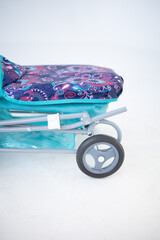 Toy stroller blue on a white background