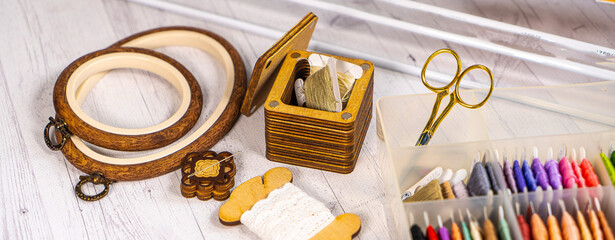 Accessories for hobby. Hoop snaps, threads, needles and scissors. Vintage tools for embroidery and knitting © Iryna