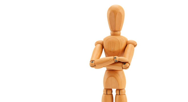 A wooden artist's mannequin stands with arms crossed against a black backdrop.