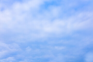 Beautiful blue sky and white fluffy group of clouds background in the morning skyline