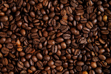 Roasted coffee beans close-up background