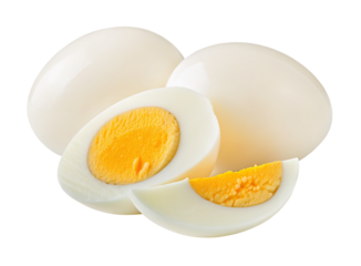 Whole and sliced hard boiled eggs with yellow yolk on a plain white background in bright light