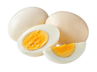 Whole eggs and sliced hard-boiled eggs on a plain white background in a close-up arrangement