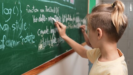 Diverse student studying coding engineering prompt while writing answer on blackboard. Intelligence...