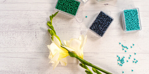 Colorful glass beads with flowers. Variety of shapes and colors to make a bead necklace or a string...