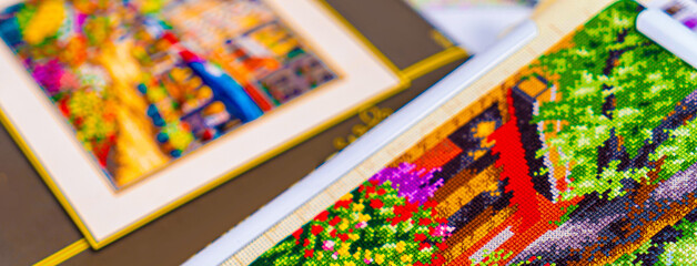 Threads for embroidery. Embroidered picture. Set for beading.