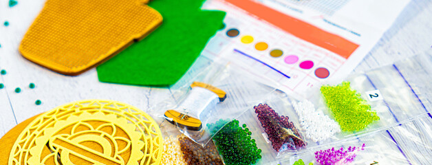 Set for beading. Beads in packages. Threads in the palette