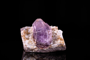 Amethyst crystal. Specimen from Erongo, Namibia. photography isolated on black background. macro detail close-up mineral crystal unpolished semi-precious gemstone