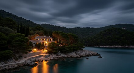 Obraz premium Serene Coastal Villa at Dusk A Breathtaking Night Scene