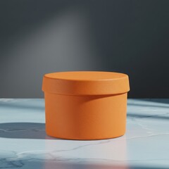 Minimalist orange cylinder podium with soft shadows and dappled light on a marble surface