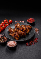 Grilled or barbecued chicken wings with teriyaki sauce, spices and sesame seeds. Teriyaki chicken
