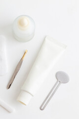 Minimal Skincare Flat Lay with Dropper Bottle and Face Tools