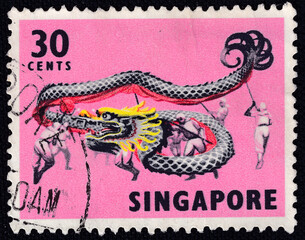 Dragon dance on a 1973 Singapore postage stamp. Traditional Dances and Musical Instruments Series.
