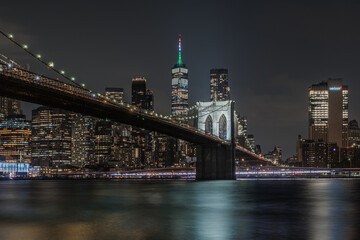 Scenic night view of Brooklyn Bridge with the distinctive Manhattan skyline in the background