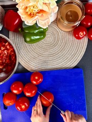 Sliced Roma Tomatoes on a Wooden Cutting Board