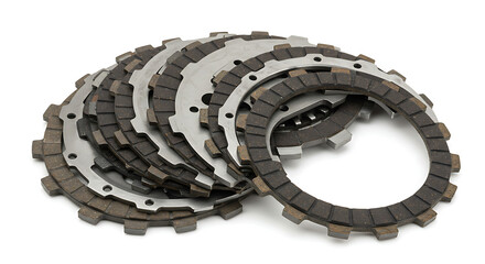 A complete motorcycle clutch kit, featuring a new set of friction and steel plates, neatly fanned out and isolated on a clean white background. 