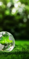 Nature's reflection glass globe symbolizing earth on lush green grass outdoor scene close-up view environmental awareness